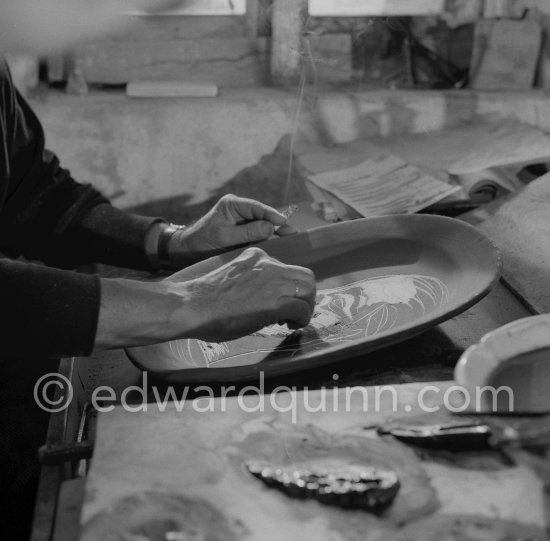 Pablo Picasso working on first version of plate of a woman (Irène Rignault, Madame X), during filming of "Pablo Picasso", directed by Luciano Emmer. Madoura pottery, Vallauris 14.10.1953. - Photo by Edward Quinn