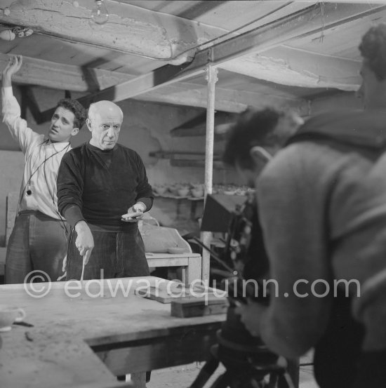 Pablo Picasso would sometimes squeeze a vase before the clay had hardened, molding it into a representational shape. "To give it life," he once said, "I have to wring its neck." Delighted that he could make the clay respond to any fantasy that passed through his mind, he shaped mythologicat figures such as fauns and satyrs, as well as vases representing graceful women, bulls, goats, fish, and above all, owls and doves. Here Pablo Picasso is working on small bird sculpture, Luciano Emmer film. Madoura pottery, Vallauris 14./15.10.1953. - Photo by Edward Quinn