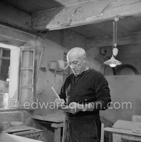 Pablo Picasso would sometimes squeeze a vase before the clay had hardened, molding it into a representational shape. "To give it life," he once said, "I have to wring its neck." Delighted that he could make the clay respond to any fantasy that passed through his mind, he shaped mythologicat figures such as fauns and satyrs, as well as vases representing graceful women, bulls, goats, fish, and above all, owls and doves. Here Pablo Picasso is working on small bird sculpture, Luciano Emmer film. Madoura pottery, Vallauris 14./15.10.1953. - Photo by Edward Quinn