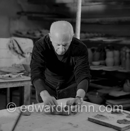 Picasso would sometimes squeeze a vase before the clay had hardened, molding it into a representational shape. "To give it life," he once said, "I have to wring its neck." Delighted that he could make the clay respond to any fantasy that passed through his mind, he shaped mythologicat figures such as fauns and satyrs, as well as vases representing graceful women, bulls, goats, fish, and above all, owls and doves. Here Picasso is working on small bird sculpture, Luciano Emmer film. Madoura pottery, Vallauris 14./15.10.1953. - Photo by Edward Quinn