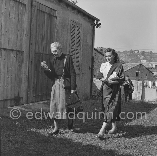 Jeanne Huguet ("Totote", widow of the catalan sculptor Manolo Huguet), widow of the catalan sculptor Manolo Huguet, and not yet identified woman in front of Le Fournas. Paulo Picasso in the background. Vallauris 1953. - Photo by Edward Quinn