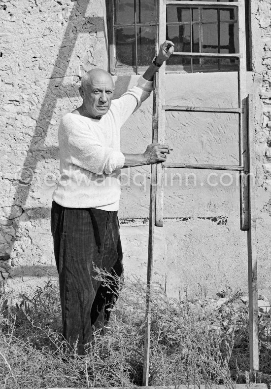 Pablo Picasso with ladder outside studio Le Fournas, Vallauris 1953. - Photo by Edward Quinn