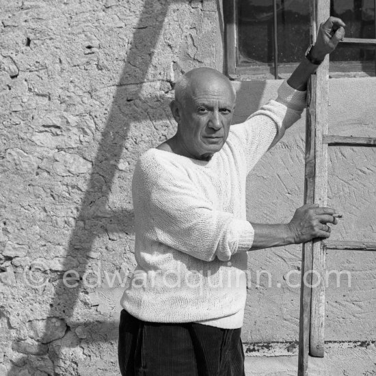 Pablo Picasso with ladder outside studio Le Fournas, Vallauris 1953. - Photo by Edward Quinn