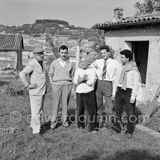 Outside Le Fournas, Luciano Emmer film team. Second from left, beside Pablo Picasso, director Luciano Emmer. Vallauris 1953. - Photo by Edward Quinn