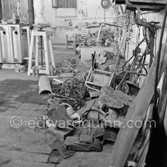 Pablo Picasso working in his sculpture studio Le Fournas making a sculpture figure with odds and ends from his scrap heap. The finished sculpture got the name "La femme à la clé (La Taulière)" ("Woman with a key"). Le Fournas, Vallauris 1953. - Photo by Edward Quinn