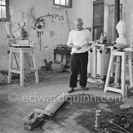 Pablo Picasso working in his sculpture studio Le Fournas making a sculpture figure with odds and ends from his scrap heap. The finished sculpture got the name "La femme à la clé (La Taulière)", ("Woman with a key"). Vallauris 1953. - Photo by Edward Quinn