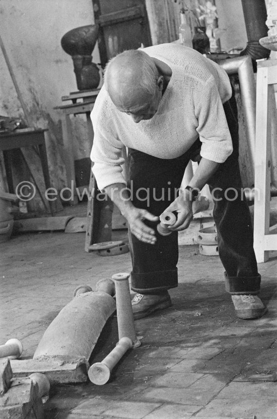 Pablo Picasso working in his sculpture studio Le Fournas making a sculpture figure with odds and ends from his scrap heap. The finished sculpture got the name "La femme à la clé (La Taulière)" ("Woman with a key"). Le Fournas, Vallauris 1953. - Photo by Edward Quinn