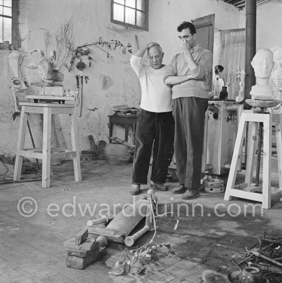 Pablo Picasso working in his sculpture studio Le Fournas making a sculpture figure with odds and ends from his scrap heap. The branch was later replaced by a key. The finished sculpture got the name "La femme à la clé (La Taulière)" ("Woman with a key"). Le Fournas, Vallauris 1953. - Photo by Edward Quinn