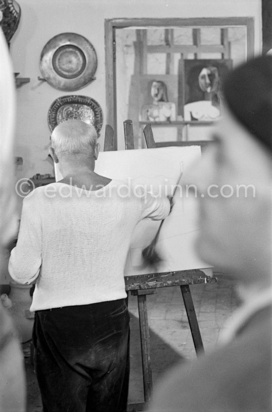 Pablo Picasso doing a charcoal drawing of the view from Le Fournas during filming of Luciano Emmer's documentary. Vallauris 26.6.53. - Photo by Edward Quinn