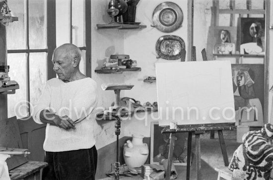 Pablo Picasso doing a charcoal drawing of the view from Le Fournas during filming of Luciano Emmer's documentary. Vallauris 26.6.1953. - Photo by Edward Quinn
