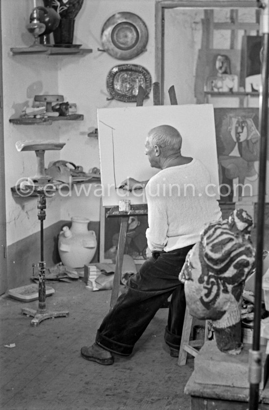 Pablo Picasso doing a charcoal drawing of the view from Le Fournas during filming of Luciano Emmer's documentary. Vallauris 26.6.1953. - Photo by Edward Quinn