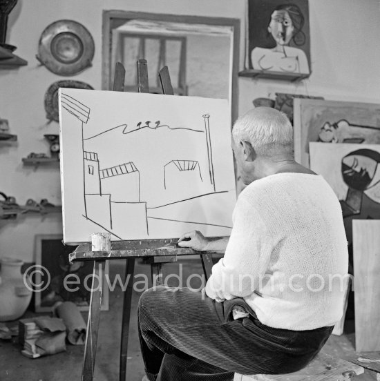 Pablo Picasso doing a charcoal drawing of the view from Le Fournas during filming of Luciano Emmer's documentary. Vallauris 26.6.1953. - Photo by Edward Quinn