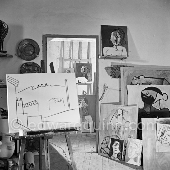 Pablo Picasso doing a charcoal drawing of the view from Le Fournas during filming of Luciano Emmer's documentary. Vallauris 26.6.1953. - Photo by Edward Quinn