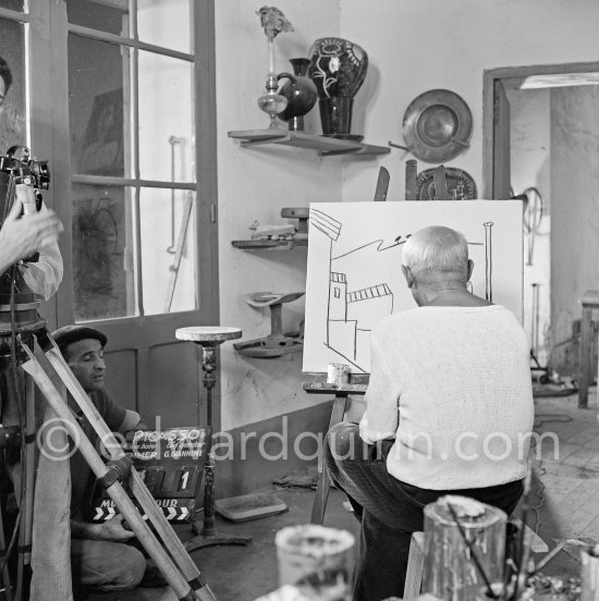 Pablo Picasso doing a charcoal drawing of the view from Le Fournas during filming of Luciano Emmer's documentary. Vallauris 26.6.1953. - Photo by Edward Quinn