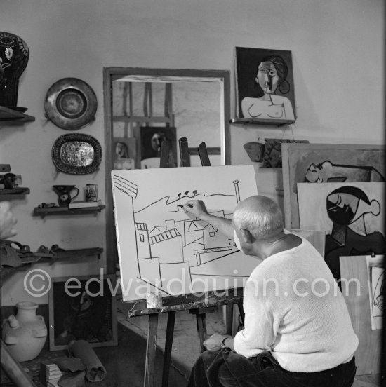 Pablo Picasso doing a charcoal drawing of the view from Le Fournas during filming of Luciano Emmer\'s documentary. Vallauris 26.6.1953. - Photo by Edward Quinn