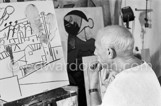 Pablo Picasso doing a charcoal drawing of the view from Le Fournas during filming of Luciano Emmer's documentary. Vallauris 26.6.1953. - Photo by Edward Quinn