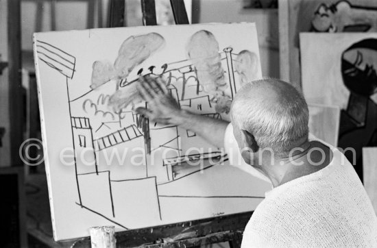 Pablo Picasso doing a charcoal drawing of the view from Le Fournas during filming of Luciano Emmer's documentary. Vallauris 26.6.1953. - Photo by Edward Quinn