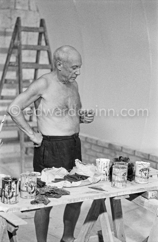 Pablo Picasso working on the "War and Peace study" drawings on the wall of Chapelle de la Paix (or Temple de la Paix) for the documentary film of Luciano Emmer. (The panels of War and Peace of 1952 were away on exhibition). Vallauris 1953. - Photo by Edward Quinn