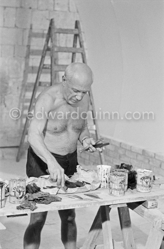 Pablo Picasso working on the "War and Peace study" drawings on the wall of Chapelle de la Paix (or Temple de la Paix) for the documentary film of Luciano Emmer. (The panels of War and Peace of 1952 were away on exhibition). Vallauris 1953. - Photo by Edward Quinn