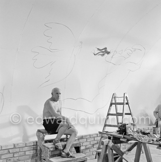 Pablo Picasso working on the "War and Peace study" drawings on the wall of Chapelle de la Paix (or Temple de la Paix) for the documentary film of Luciano Emmer. (The panels of War and Peace of 1952 were away on exhibition). Vallauris 1953. - Photo by Edward Quinn