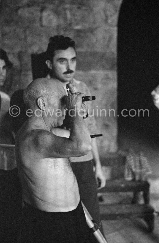 Pablo Picasso and film director Luciano Emmer. Filming of Pablo Picasso working on the "War and Peace study" drawings on the wall of Chapelle de la Paix (or Temple de la Paix). Vallauris 1953. - Photo by Edward Quinn