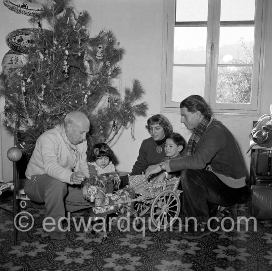 A rare document of Pablo Picasso with his four children, Paloma Picasso, Maya Picasso, Claude Picasso and Paulo Picasso. Christmastime at La Galloise. The wagon was a gift from reporter Alfredo Quaglino and comes from Sicily. Vallauris 1953. - Photo by Edward Quinn