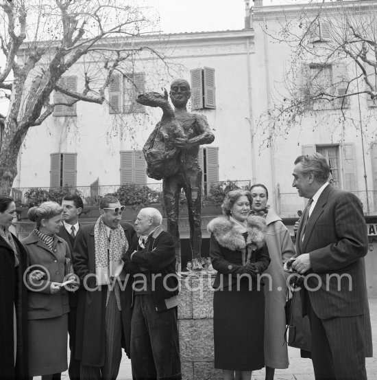 Pablo Picasso with a Sovjet Film delegation. From left Catherine Litvinenko, Hélène Parmelin, Paulo Picasso, Serge Youtkevitch (director), Pablo Picasso, Ljubov Orlova (with fur collar), Klara Luchko, Grigori Alexandrov (director). In front of Pablo Picasso sculpture "L’homme au mouton". Place Paul Isnard, Vallauris 1954. - Photo by Edward Quinn