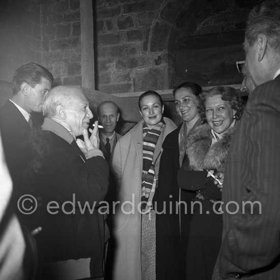 Pablo Picasso with a Sovjet Film delegation. From left Paulo Picasso, Pablo Picasso, Klara Luchko, Catherine Litvinenko, Ljubov Orlova (with fur collar), Grigori Alexandrov (director). Galerie Madoura, Vallauris 1954. - Photo by Edward Quinn