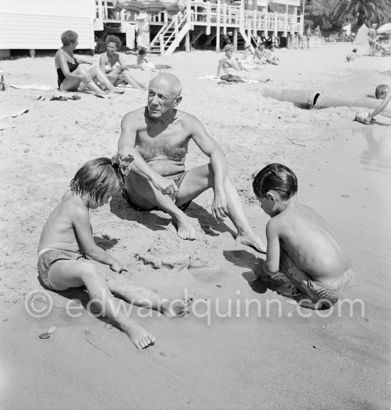 Pablo Picasso with his children Paloma Picasso and Claude Picasso at the beach of Golfe-Juan 1954. - Photo by Edward Quinn