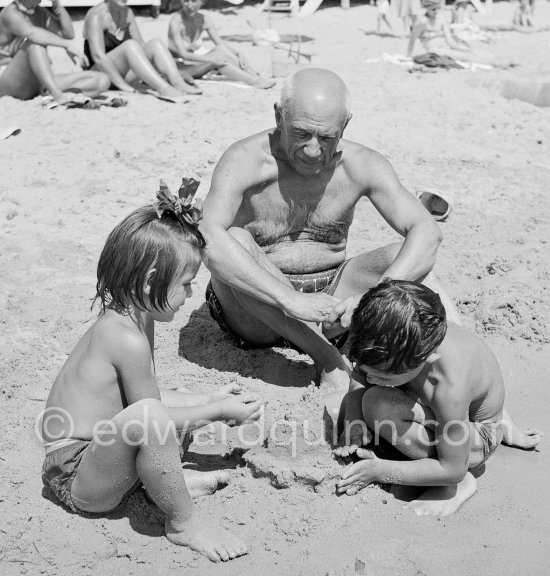 Pablo Picasso with his children Paloma Picasso and Claude Picasso at the beach of Golfe-Juan 1954. - Photo by Edward Quinn
