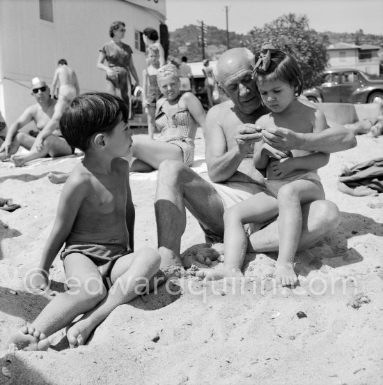 Pablo Picasso with his children Paloma Picasso and Claude Picasso at the beach of Golfe-Juan 1954. - Photo by Edward Quinn