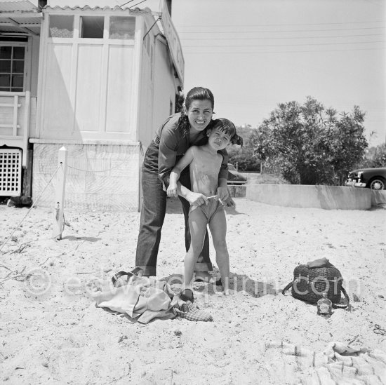 Françoise Gilot and Paloma Picasso at the beach. Pablo Picasso's slippers. Golfe-Juan 1954. - Photo by Edward Quinn