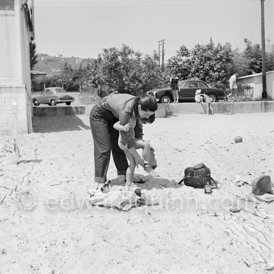 Françoise Gilot and Paloma Picasso at the beach. Pablo Picasso's slippers. Golfe-Juan 1954. - Photo by Edward Quinn