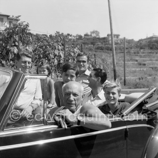 Behind Pablo Picasso: Paulo Picasso, Claude Picasso and daughter Paloma Picasso with friends Francisco Reina "El Minuni", banderillero andaluz, Eugenio Carmona and the son of the writer José Herrera-Petere. Vallauris 1954. Car: Talbot-Lago Record T26 1949 - Photo by Edward Quinn
