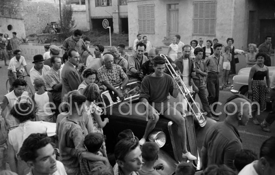 Parade which proceeded the bullfight staged by Pablo Picasso. Paulo Picasso far right with special haircut. Vallauris 1954. Car: Mathis EMY 4-S 1934 Saint Moritz - Photo by Edward Quinn