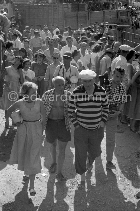 Pablo Picasso in crowd with Edouard Pignon (and Geneviève Laporte?) Vallauris 1955 - Photo by Edward Quinn