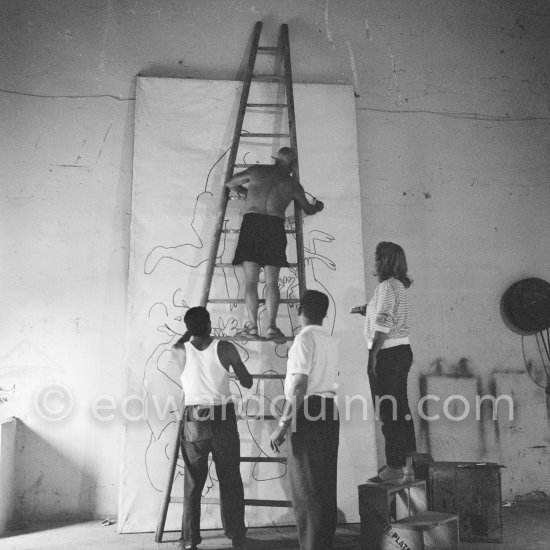 Pablo Picasso working on a bucolic pastoral scene on drawing paper which was to serve as background for the film "Le mystère Picasso". Maya Picasso on the right. Nice, Studios de la Victorine 1955. - Photo by Edward Quinn