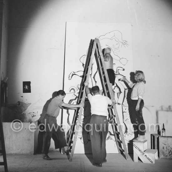 Pablo Picasso working on a bucolic pastoral scene on drawing paper which was to serve as background for the film "Le mystère Picasso". Maya Picasso on the right. Nice, Studios de la Victorine 1955. - Photo by Edward Quinn