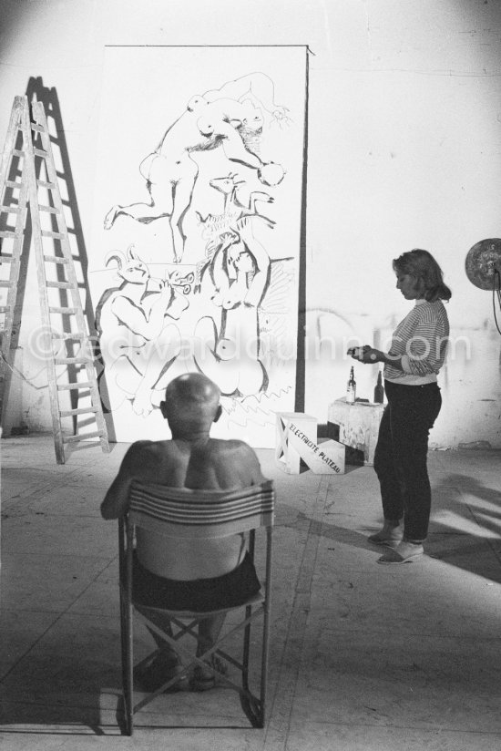 Pablo Picasso working on a bucolic pastoral scene on drawing paper which was to serve as background for the film "Le mystère Picasso". Maya Picasso on the right. Nice, Studios de la Victorine 1955. - Photo by Edward Quinn