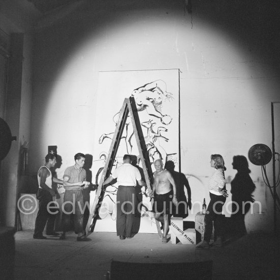 Pablo Picasso working on a bucolic pastoral scene on drawing paper which was to serve as background for the film "Le mystère Picasso". Maya Picasso on the right. Nice, Studios de la Victorine 1955. - Photo by Edward Quinn