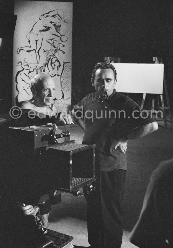 Pablo Picasso working on a bucolic pastoral scene on drawing paper which was to serve as background for the film "Le mystère Picasso". Nice, Studios de la Victorine 1955. - Photo by Edward Quinn