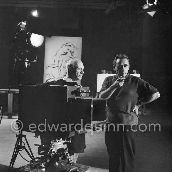 Pablo Picasso working on a bucolic pastoral scene on drawing paper which was to serve as background for the film "Le mystère Picasso". Nice, Studios de la Victorine 1955. - Photo by Edward Quinn