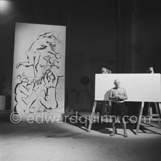 Pablo Picasso working on a bucolic pastoral scene on drawing paper which was to serve as background for the film "Le mystère Picasso". Nice, Studios de la Victorine 1955. - Photo by Edward Quinn