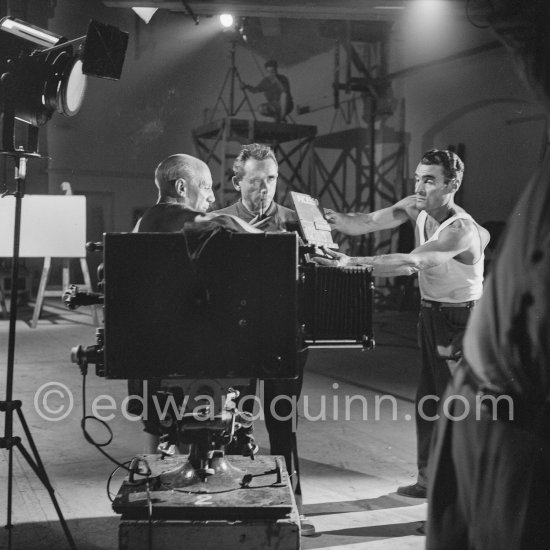 Pablo Picasso works on huge painting for décors of film. With G. H. Clouzot. "Le mystère Picasso". Nice, Studios de la Victorine 1955. - Photo by Edward Quinn