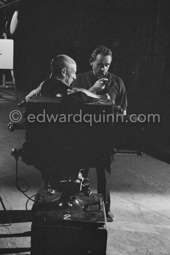 Pablo Picasso working on a bucolic pastoral scene on drawing paper which was to serve as background for the film "Le mystère Picasso". Nice, Studios de la Victorine 1955. - Photo by Edward Quinn