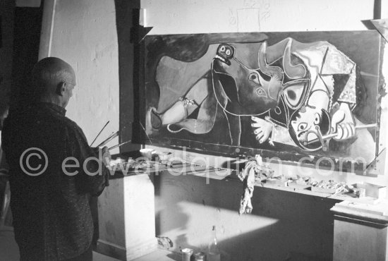 Pablo Picasso portrays a stage in the bullfight when the bullfighter is caught by the horns of the bull. During filming of "Le mystère Picasso". Nice, Studios de la Victorine, 1955. - Photo by Edward Quinn