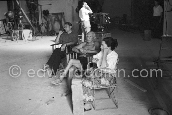 Pablo Picasso, Jacqueline and Clouzot after finishing Scène de tauromachie (Le torero soulevé) during filming of "Le mystère Picasso". Nice, Studios de la Victorine, 1955. - Photo by Edward Quinn