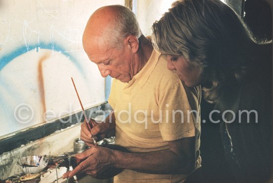 Pablo Picasso, watched by Maya Picasso, painting on a Bota de vino (bota bag or wineskin). "Le mystère Picasso", Nice, Studios de la Victorine 1955. - Photo by Edward Quinn