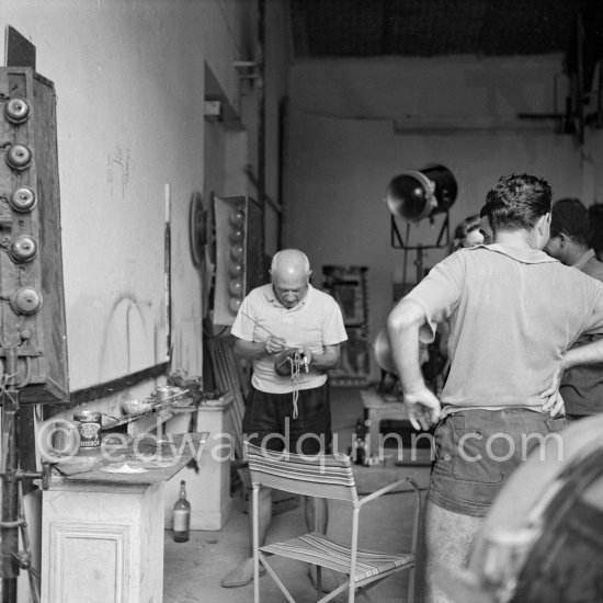 Pablo Picasso painting on a Bota de vino (bota bag or wineskin). "Le mystère Picasso", Nice, Studios de la Victorine 1955. - Photo by Edward Quinn