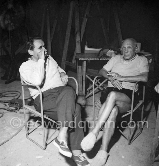 Pablo Picasso and Clouzot. Shooting break during filming of "Le mystère Picasso". Nice, Studios de la Victorine, 1955. - Photo by Edward Quinn